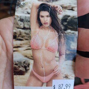Pale two piece bathing suit. New